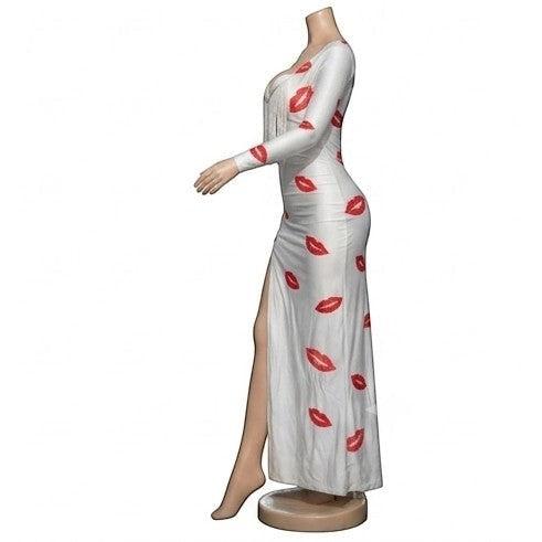 Maaak.store white maxi dress with red lip print, long sleeves, side slit, and fringe detail on the chest.