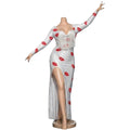 Maaak.store white maxi dress in soft butter fabric with red lip print, long sleeves, chest fringe, and side slit.